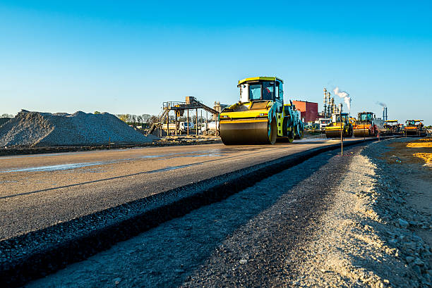 Large view on the road rollers working on the new road construction site Large view on the road rollers working on the new road construction site